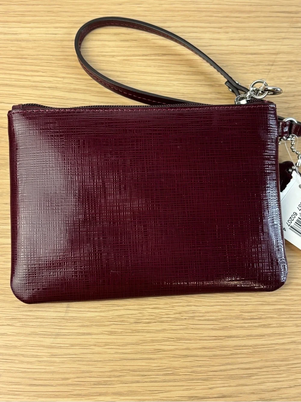 Coach Darcy Patent Leather Bow Small Wristlet in “Sherry” Wine Color NWT